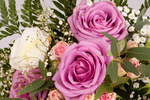 Professional florist arranging a vibrant flower bouquet